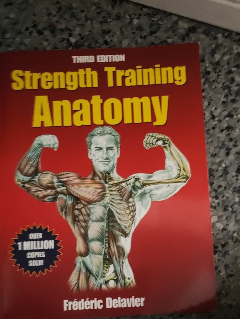 Strength Training Anatomy by Frédéric Delavier - Red Cover
